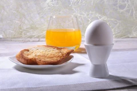 Morning Breakfast set with egg, bread toast and orange juice. Stock Photos