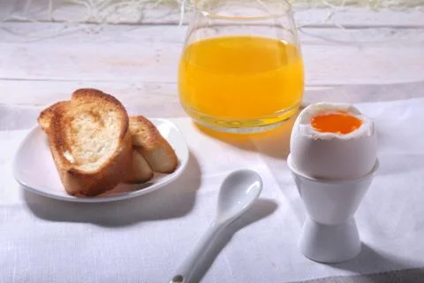 Morning Breakfast set with egg, bread toast and orange juice. Stock Photos