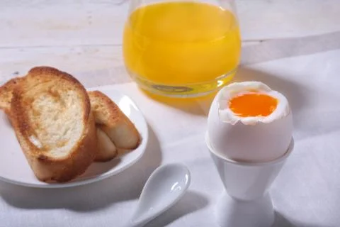 Morning Breakfast set with egg, bread toast and orange juice. Stock Photos