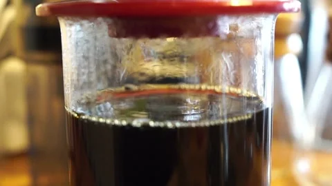 Morning brewing coffee maker pouring water close up caffeine drink utensil in Stock Footage 336561974