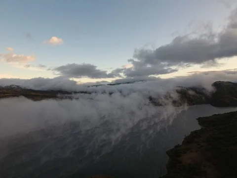 Morning clouds over a mountain lake Stock Footage 80666149