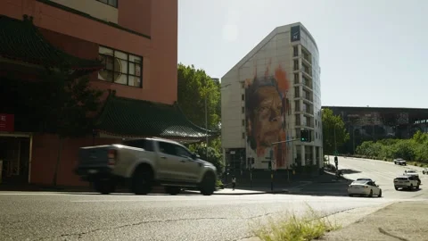 Morning commuters pass a 20 meter high Aboriginal mural in Sydney 6K Stock Footage 300908448