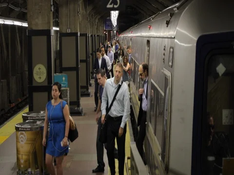 Morning commuters people coming out of train Stock Footage