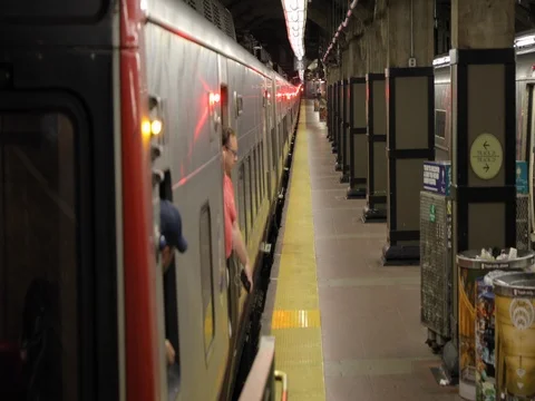 Morning commuters people coming out of train Stock Footage