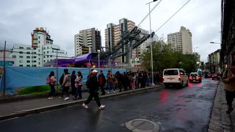 Morning Commuters Queue for Gondola Transit in Busy Urban Setting Stock Footage 319753694