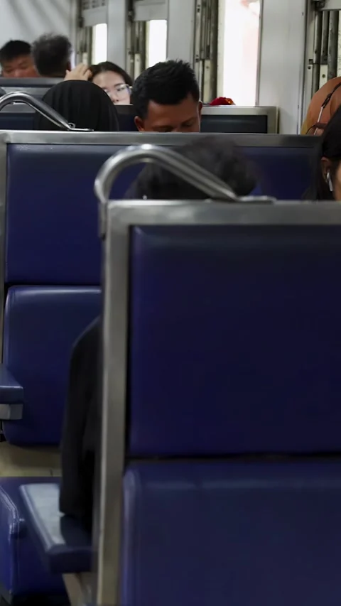 Morning Commuters Sitting Quietly Inside Bangkok Passenger Train Video stock 323683115