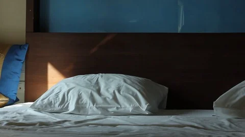 Morning crumpled unmade empty bed with two pillows Stock Footage 73787861
