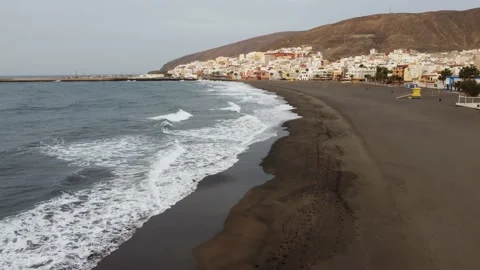 Morning drone flight over the empty beach of Gran Tarajal town in Fuerteventura Stock Footage 201811250