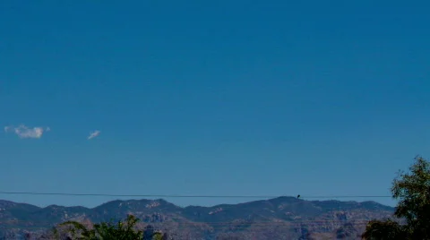 Morning event of clouds building over mountains - 1 - wide shot Stock Footage