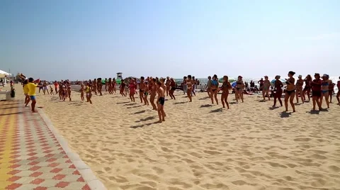 Morning Exercise on the Beach Stock Footage 58955511