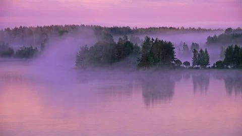 Morning fog over Soisalo island, Vehmersalmi, Kuopio, Finland Stock Photos