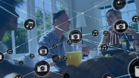 Morning group sitting as camera icon appearing, nodes growing across table Stock Footage 331634722