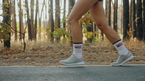 Morning jogging through the forest, only legs closeup Stock Footage 116260877