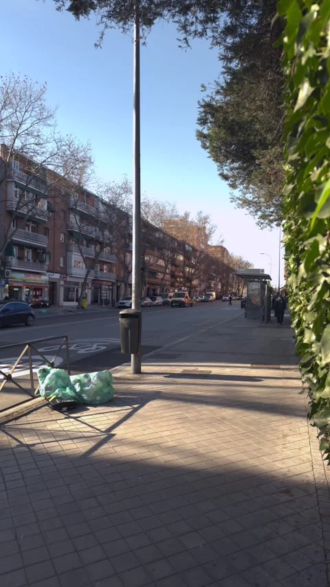 Morning light and shadow moving on a city sidewalk Stock-Footage 329510111