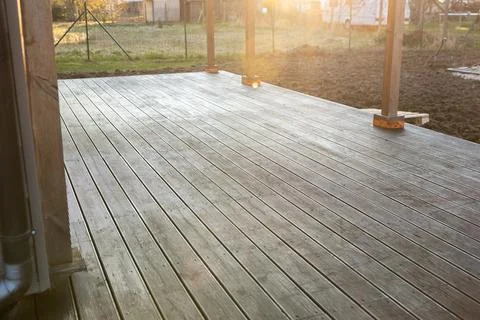 Morning light on new timber deck at residential construction site Stock Photos