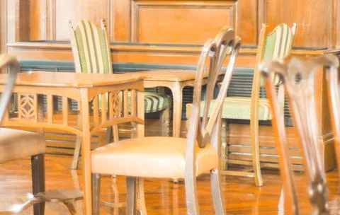 Morning light through rows of  Empty table and chairs in cafe restaurant Stock Photos