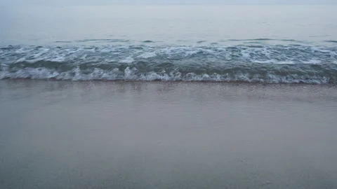 Morning light waves over sand Stock Footage 330873285