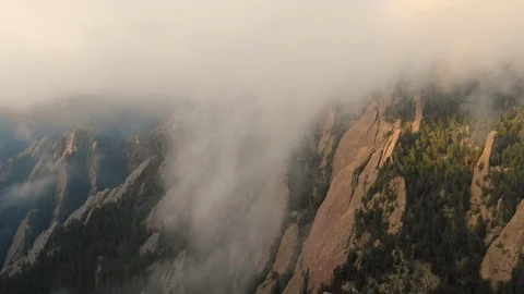 Morning mist, aerial drone flying over flat irons mountains in Boulder Colorado Stock Footage