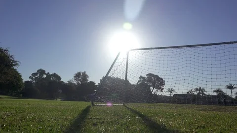 Morning at a park with a soccer football game about to begin on the grass field. Stock Footage