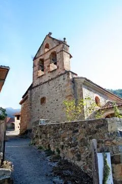 Morning street and church in a mountain village Stock Photos