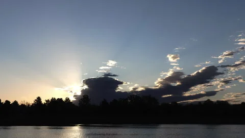 Morning Sun Emerging Behind Storm Clouds Zoom Out Timelapse Stock Footage 337124355