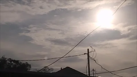 Morning Sun Shining Through Clouds in the Sky Stock Footage 297027701