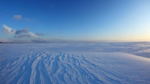 Morning Sun, Snowfield, Wind Patterns, and Horizon Video stock 324961180