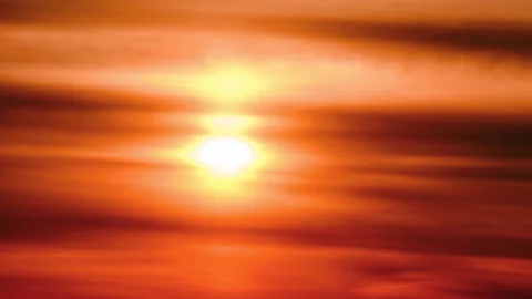 Morning sun through overcast clouds on a hot misty red sky, sunrise time lapse.  Stock Footage 175654917