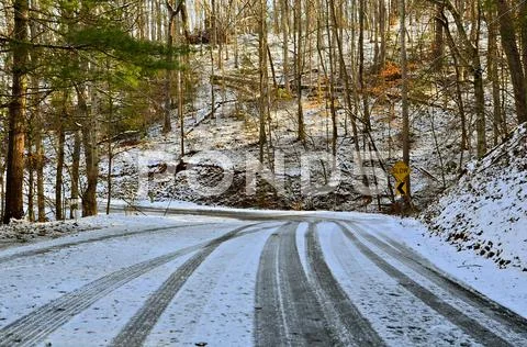 Morning sun on winter road Stock Photos
