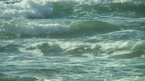 Morning sunlight illuminates green waves Stock Footage