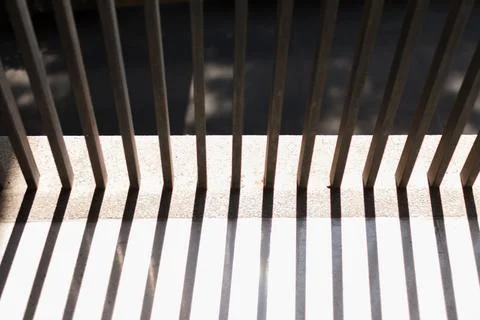 The morning sunlight shining through the rectangular pillars. parallel lines  Stock Photos