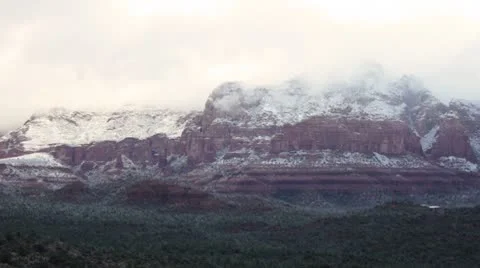 Morning Sunlight through the Clouds over the Snowy Mountains of Sedona Wide Stock Footage 8955509