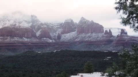 Morning Sunlight through the Clouds over the Snowy Mountains of Sedona 2 Vídeo Stock 8955518