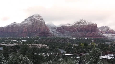 Morning Sunlight through the Clouds over the Snowy Mountains of Sedona 3 Vídeo Stock 8955521