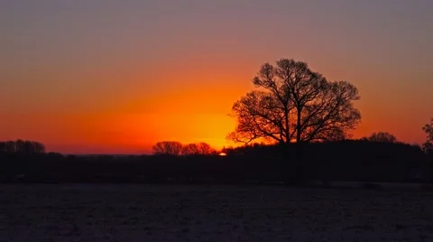 Morning sunrise over winter countryside landscape time lapse Stock Footage