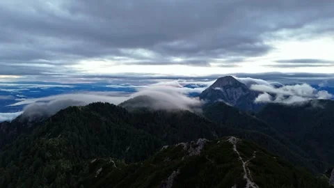 Morning Timelapse Above Rolling Clouds and Dark Alpine Mountain Peaks Video stock 345514268