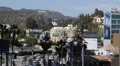 Morning Traffic Commuters on Highland Avenue Franklin Hollywood Hills Sign, LA HD Footage