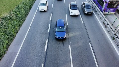 Morning Traffic Flow on E5 Highway with Metrobus Line in Istanbul Stock Footage 320237906