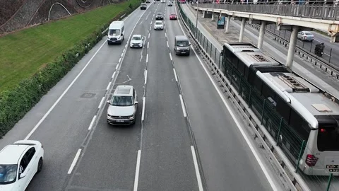 Morning Traffic Flow on E5 Highway with Metrobus Line in Istanbul Stock Footage 320393606