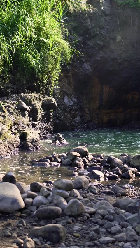 A morning view of the clear river surrounded by rocks Stock Footage 339039674