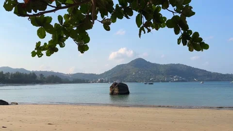 Morning View of Empty Kamala Beach in Phuket with Calm Ocean and Rock Boulder Stock Footage 328342019