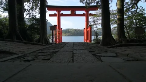 Morning view of the red torii gate of Hakone shrine from lake Ashi, Hakone Stock Footage 155664800