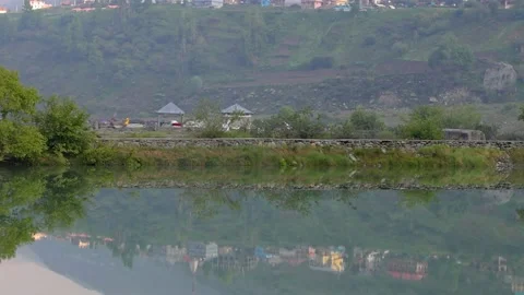 Morning view of Sissue lake with reflection of snow capped mountains Stock Footage 211815748