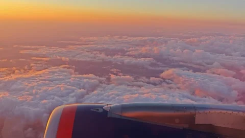 Morning view of the sunset through the window during the airplane flight. Stock Footage 283569500