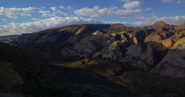 Morning’s first rays into Waterpocket Fold, Capitol Reef National Park, Utah Stock Footage 85480718