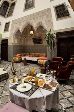 Moroccan breakfast served inside a luxurious riad in the old medina of Fez Stock Photos