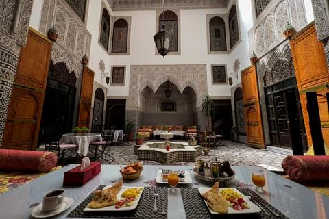 Moroccan breakfast served inside a luxurious riad in the old medina of Fez Foto stock