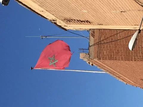 Moroccan flag on top of building Stock Photos