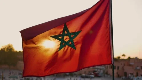 Moroccan Flag Waving in Marrakesh at Sunset (slow motion) Stock Footage 313566045