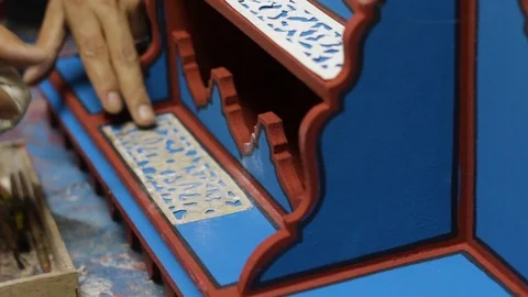The Moroccan is making some decoration to his multicolor woodwork art Stock Footage 124064477